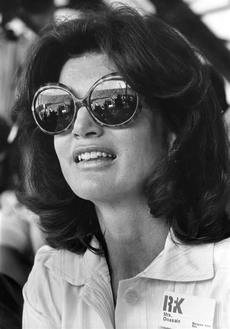 jackie o wearing sunglasses.